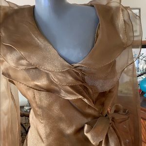 Statement piece for upscale day/evening affair.